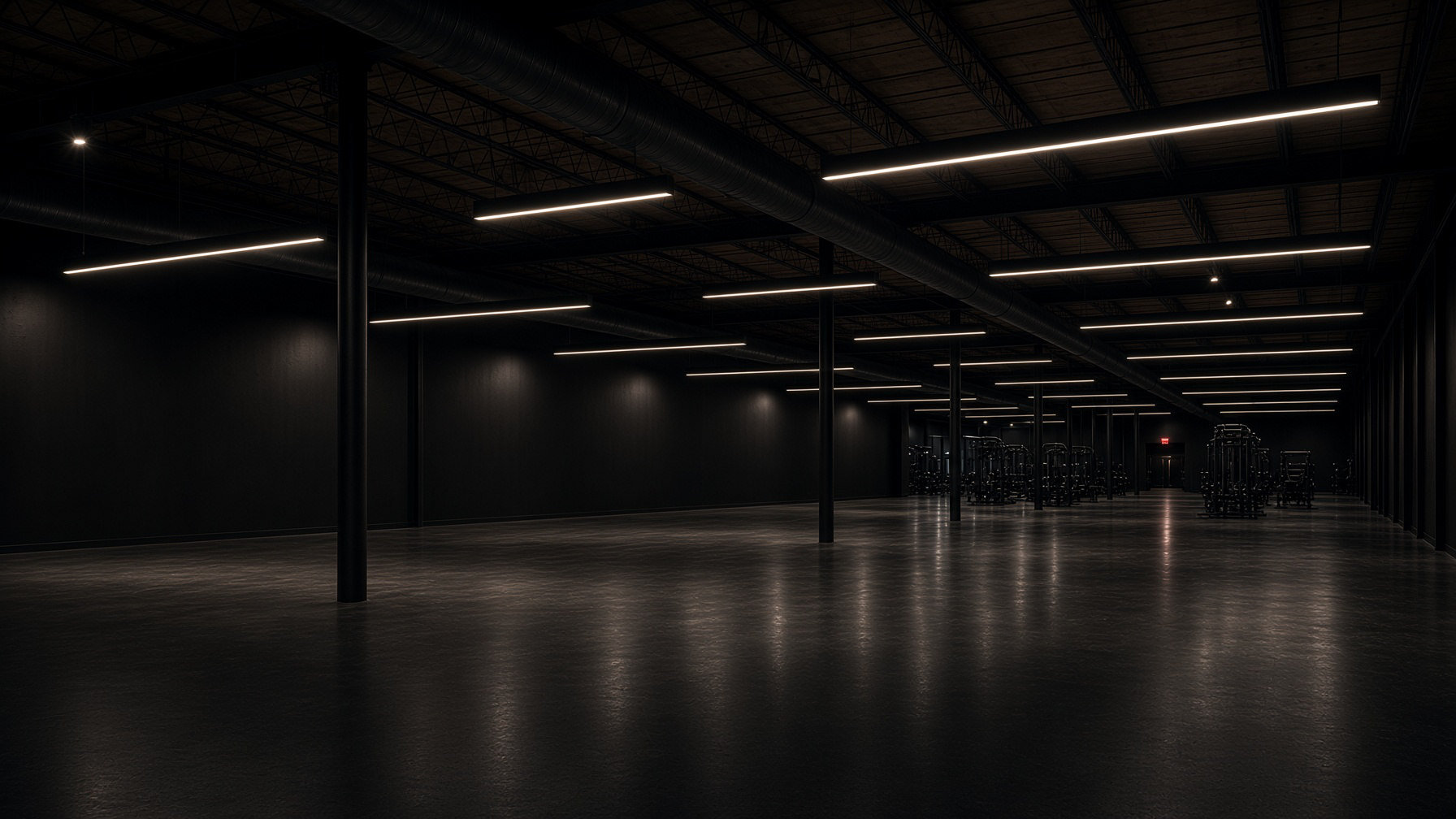 Empty dark warehouse floor under linear ceiling lights, equipment waiting in the distance